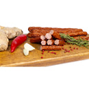 Traditional homemade sheep sausages from DELUMANI, showcasing fresh, seasoned meat links in natural casing.